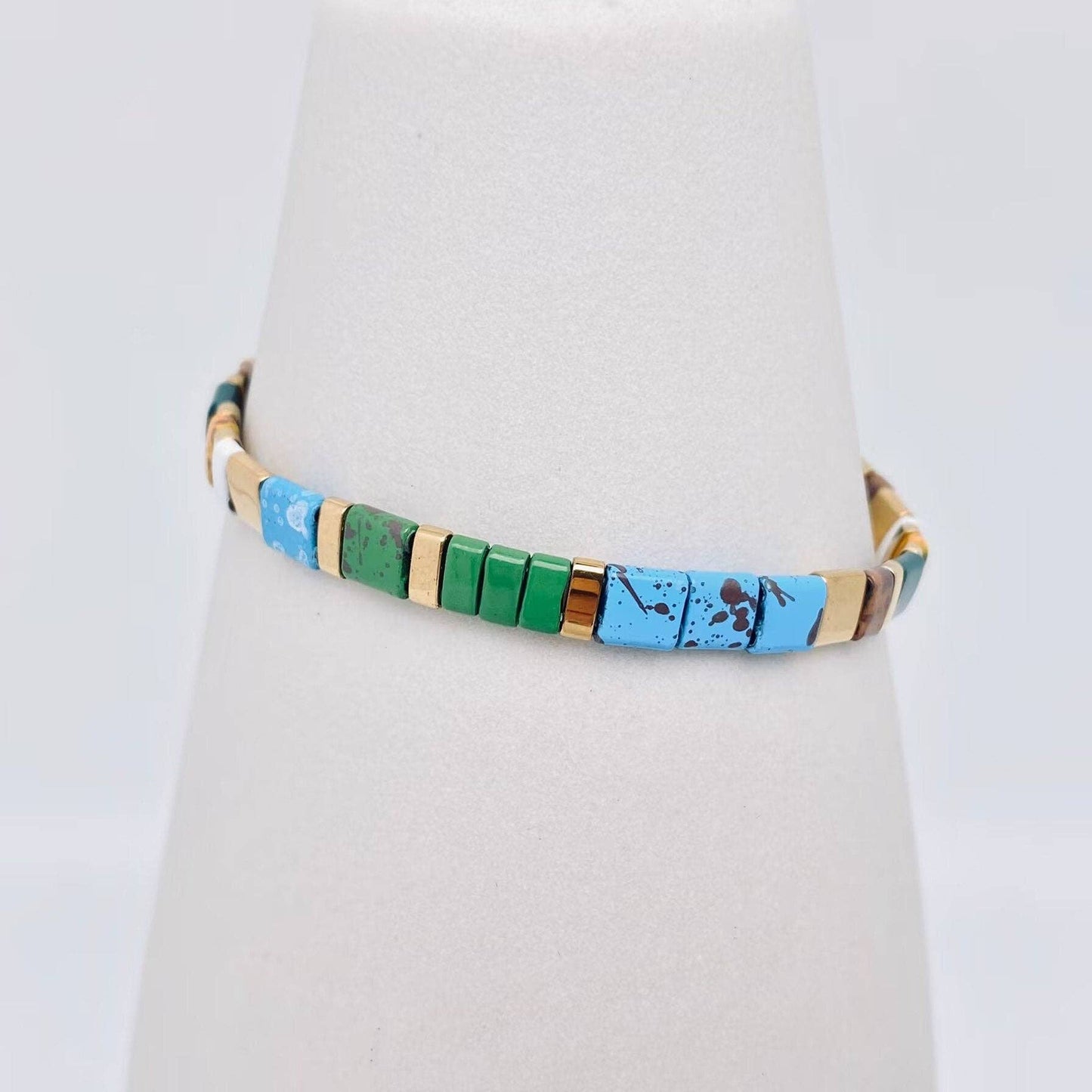 
                  
                    Glass TILA + Hematite Beaded Elastic Bracelets (Collection B)
                  
                