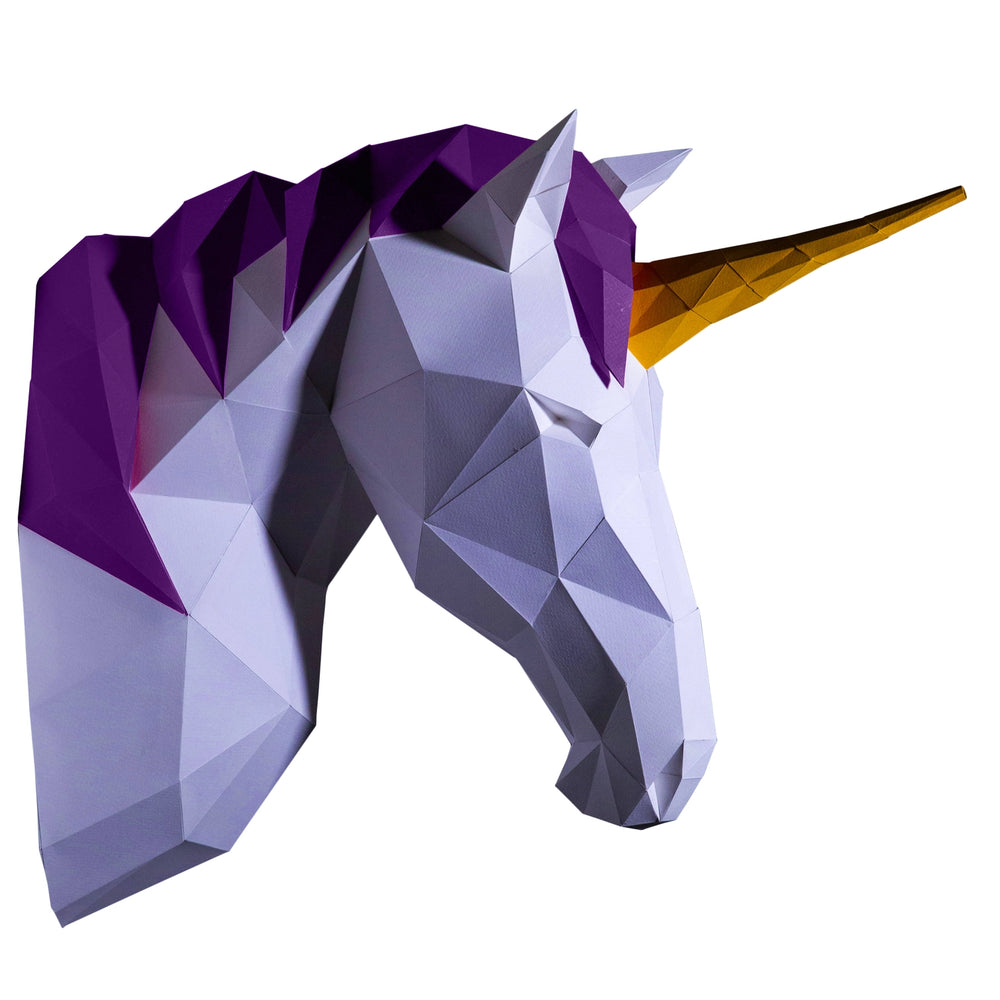 
                  
                    Side view of a unicorn faux wall mounted animal head made from diy kirigami paper wall art
                  
                