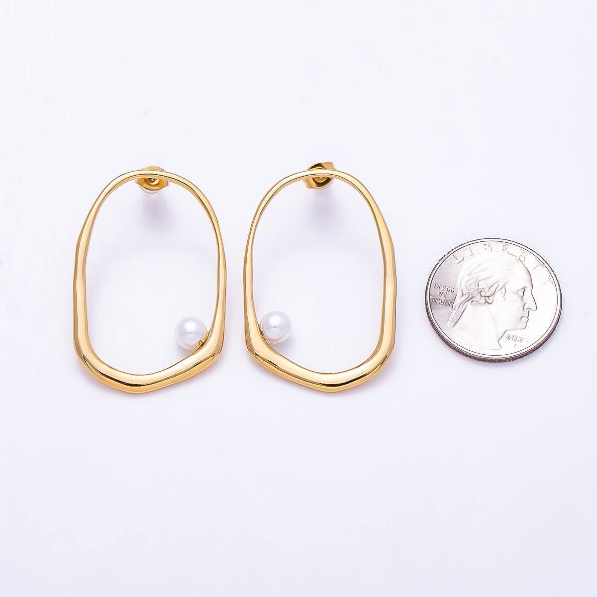
                  
                    Organic Oblong Cradled Pearl Earrings
                  
                