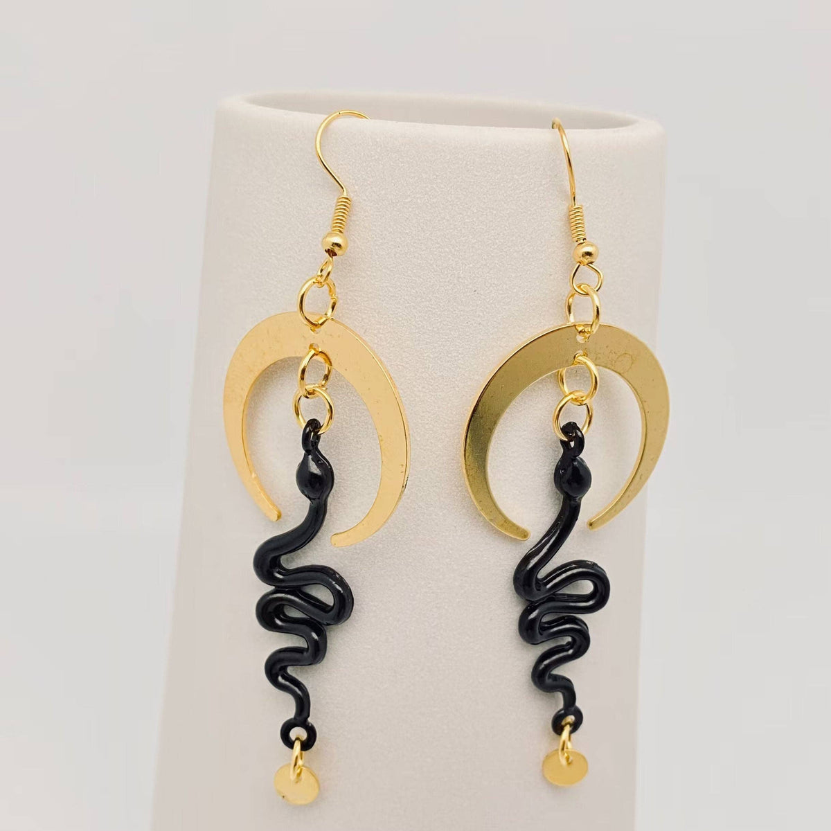 
                  
                    Nocterra Snake Earrings
                  
                
