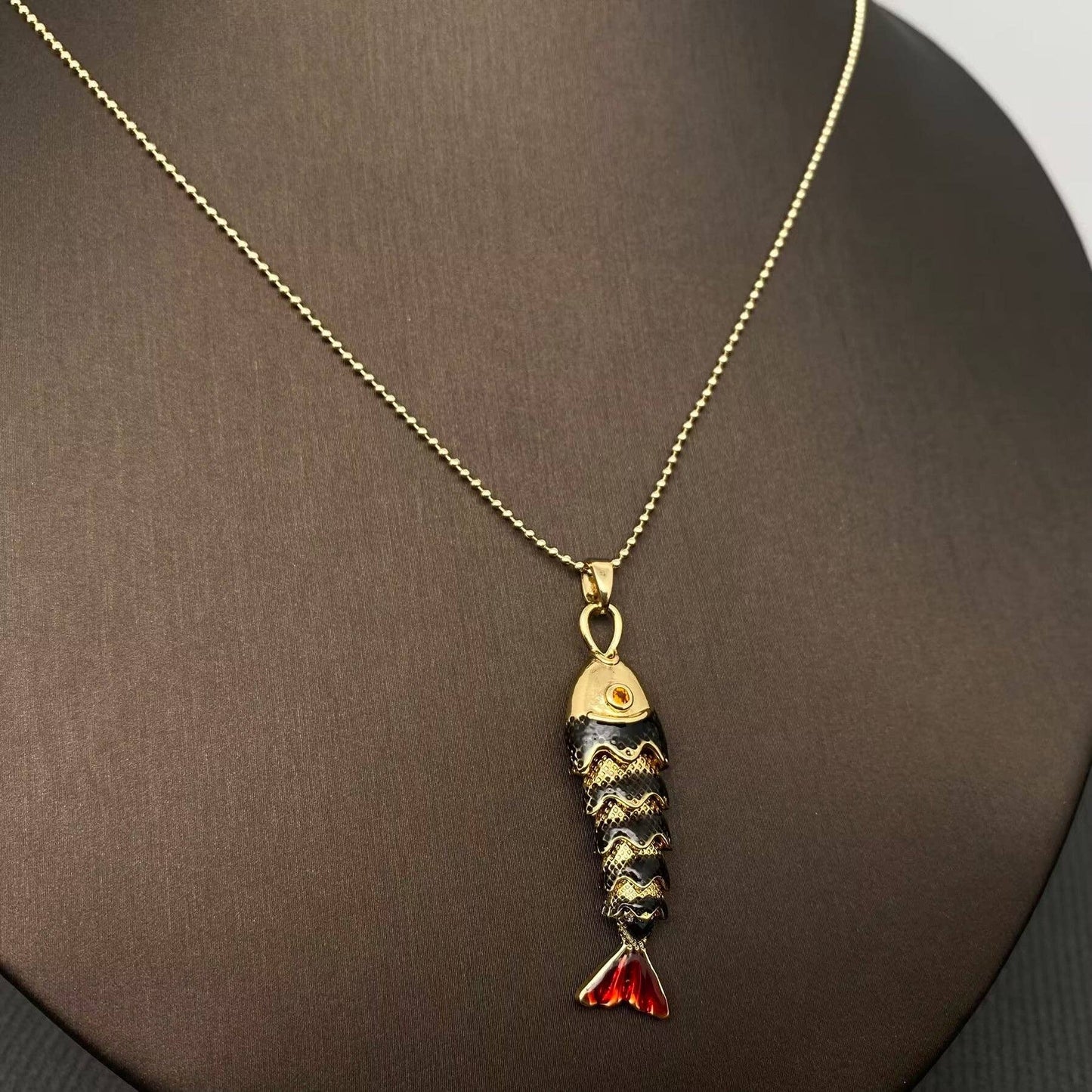 
                  
                    Enamel Wiggle Fish Necklace
                  
                