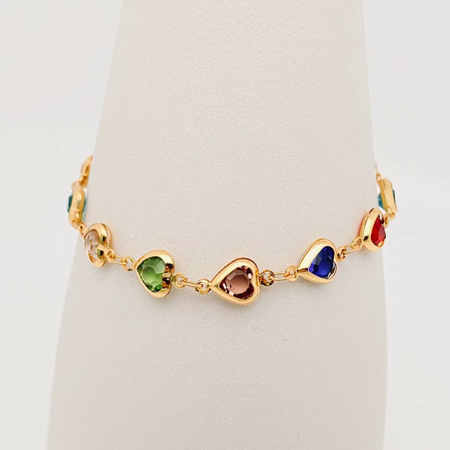 
                  
                    Linked Glass Drilled Hearts Gold-Plated Bracelet
                  
                
