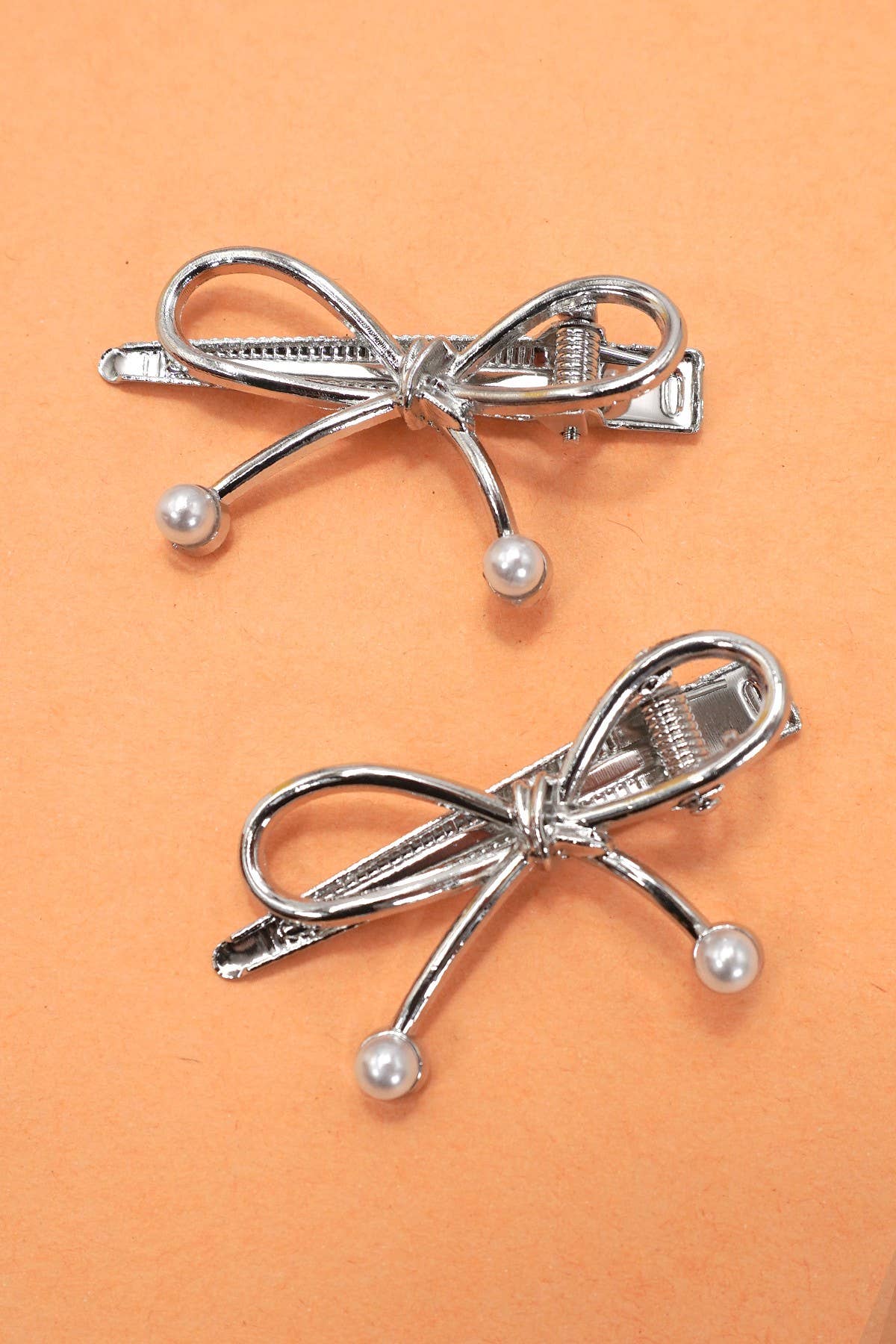 
                  
                    Bow and Pearl Metallic Duckbill Hair Clip
                  
                