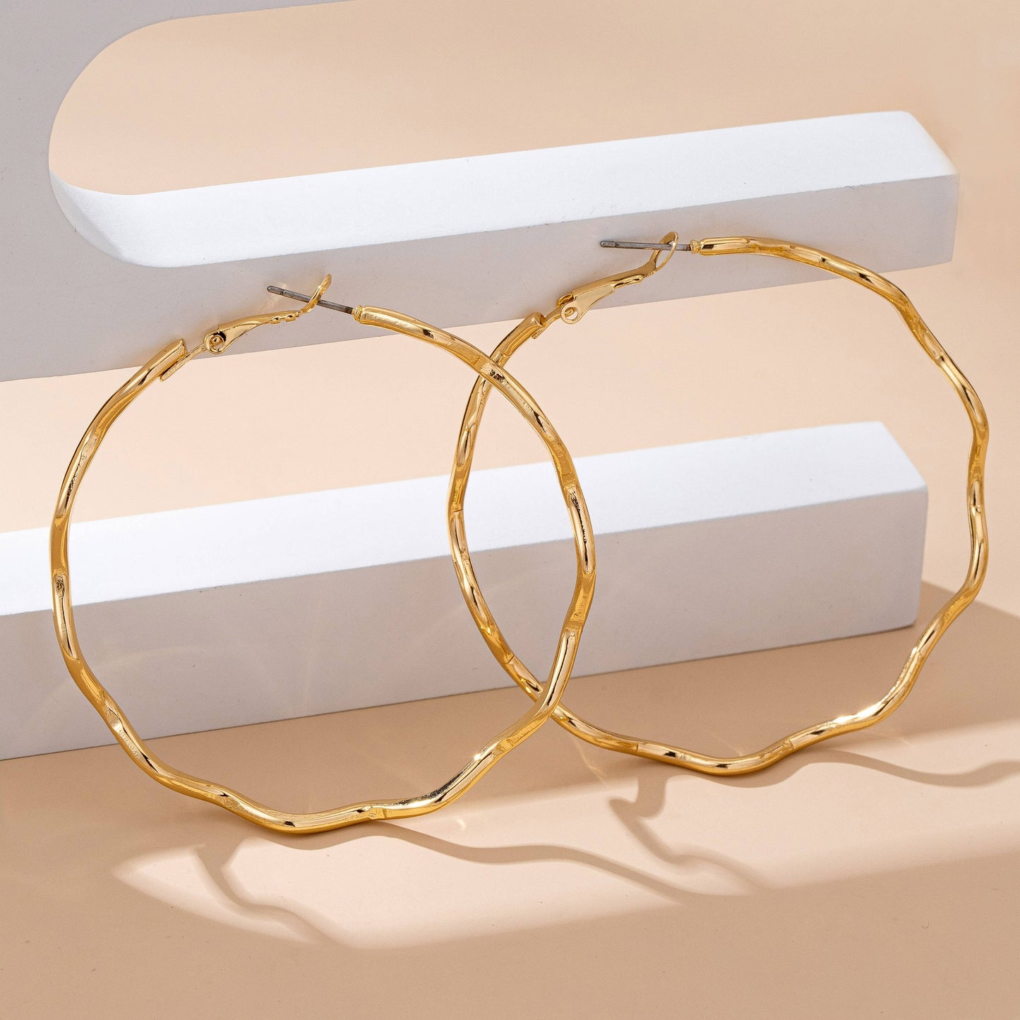
                  
                    Hammered Closed Hoop Wavy Earrings
                  
                