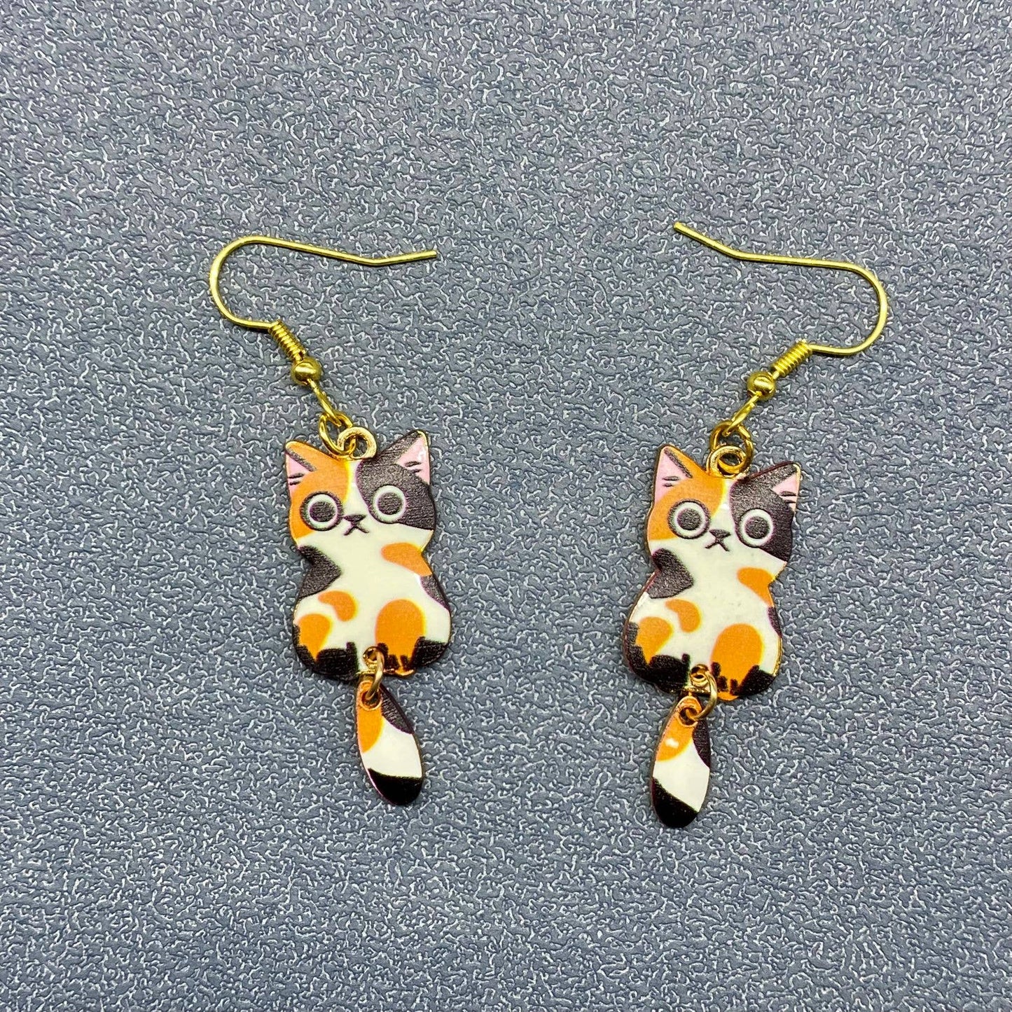 
                  
                    Swinging Tail Cat Earrings
                  
                