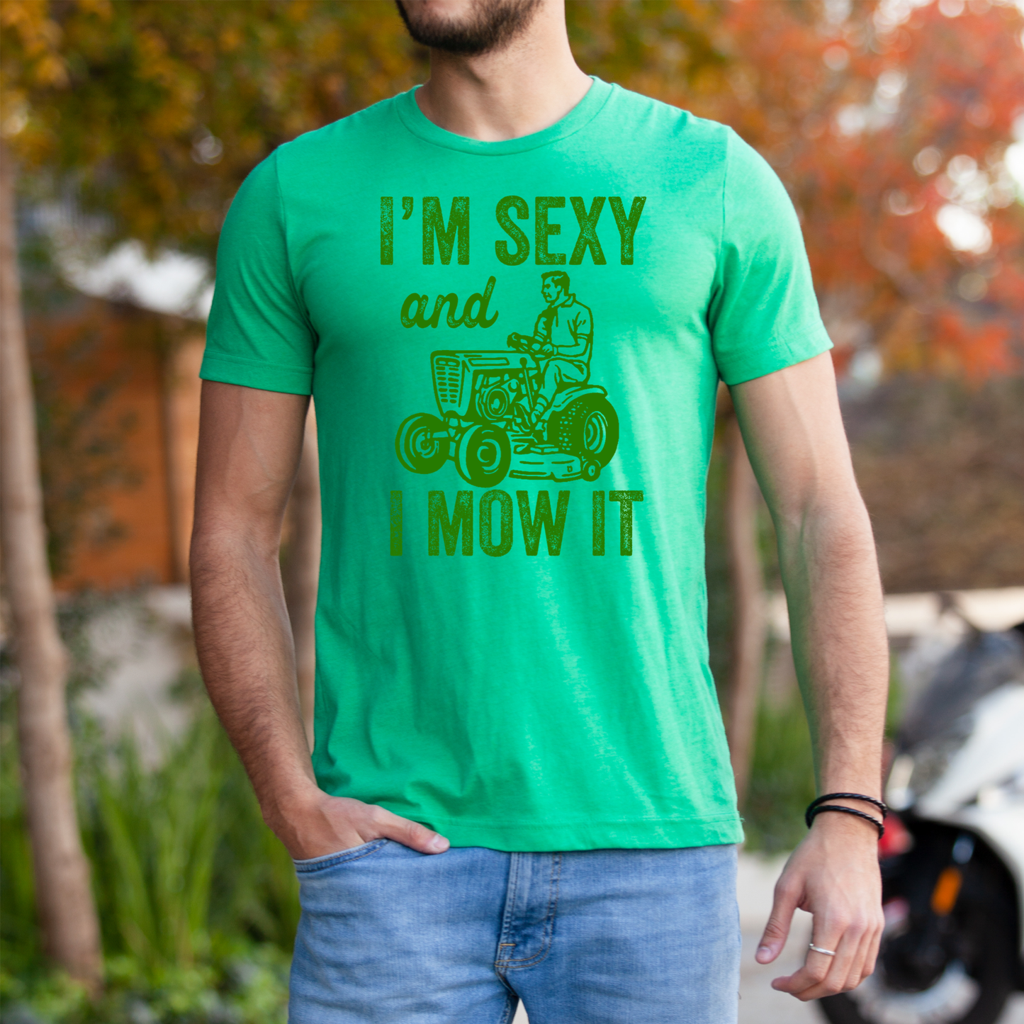 
                  
                    "I'm Sexy and I Mow It" Graphic Tee
                  
                