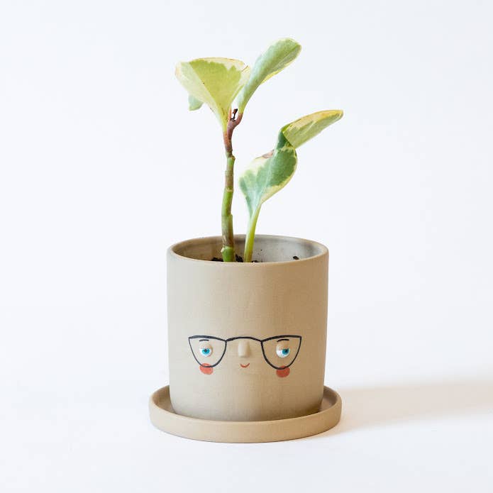 
                  
                    Faceplanter tan colored ceramic pot with glasses and rosy cheeks
                  
                