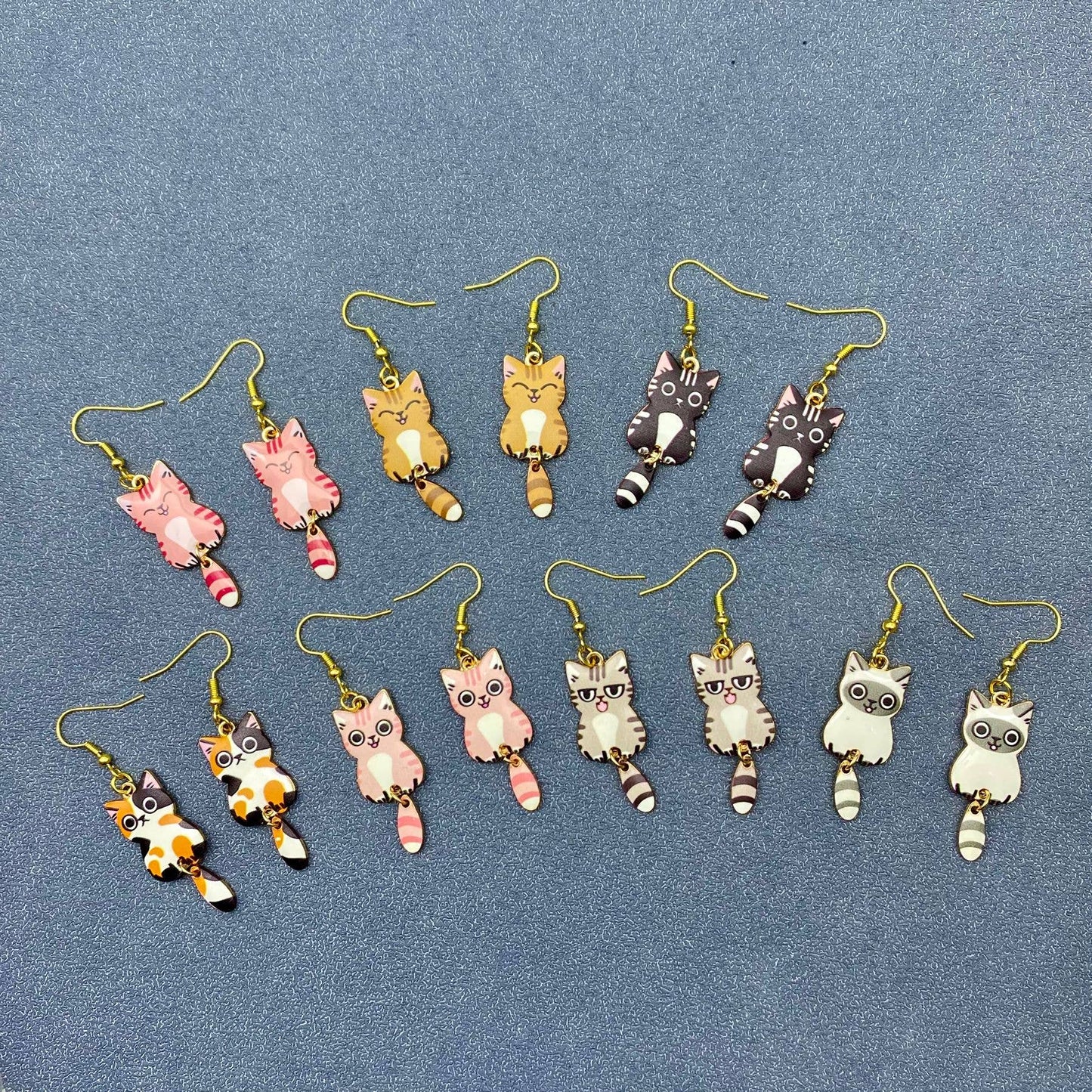 
                  
                    Swinging Tail Cat Earrings
                  
                