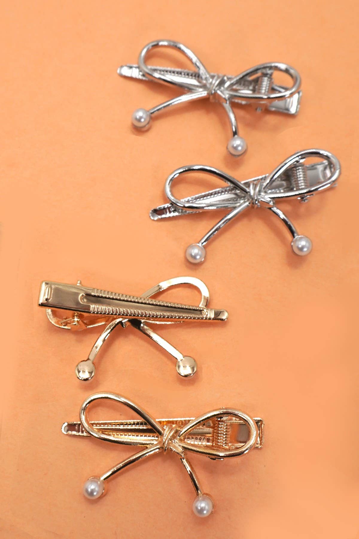 
                  
                    Bow and Pearl Metallic Duckbill Hair Clip
                  
                