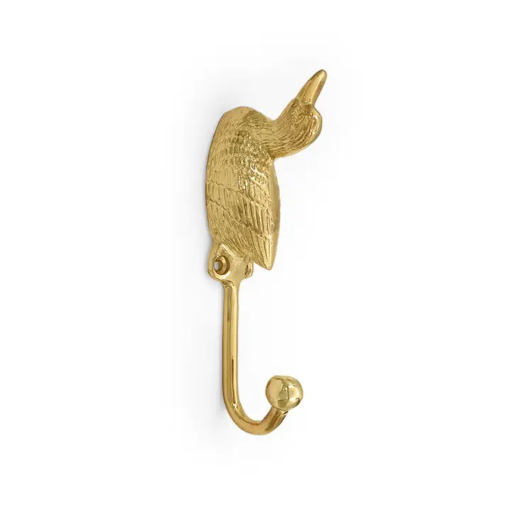 
                  
                    Swimming duck forest animal coat hook in solid brass hanging from a wall
                  
                