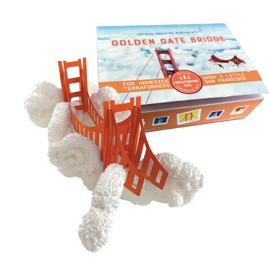 Golden Gate Bridge toy crystal growing kit, with cloud crystals swirling around the bridge