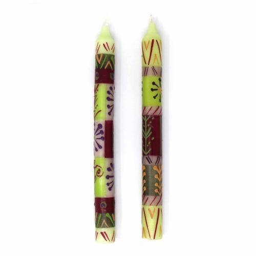 
                  
                    Two decorative candles with colorful patterns on a white background
                  
                