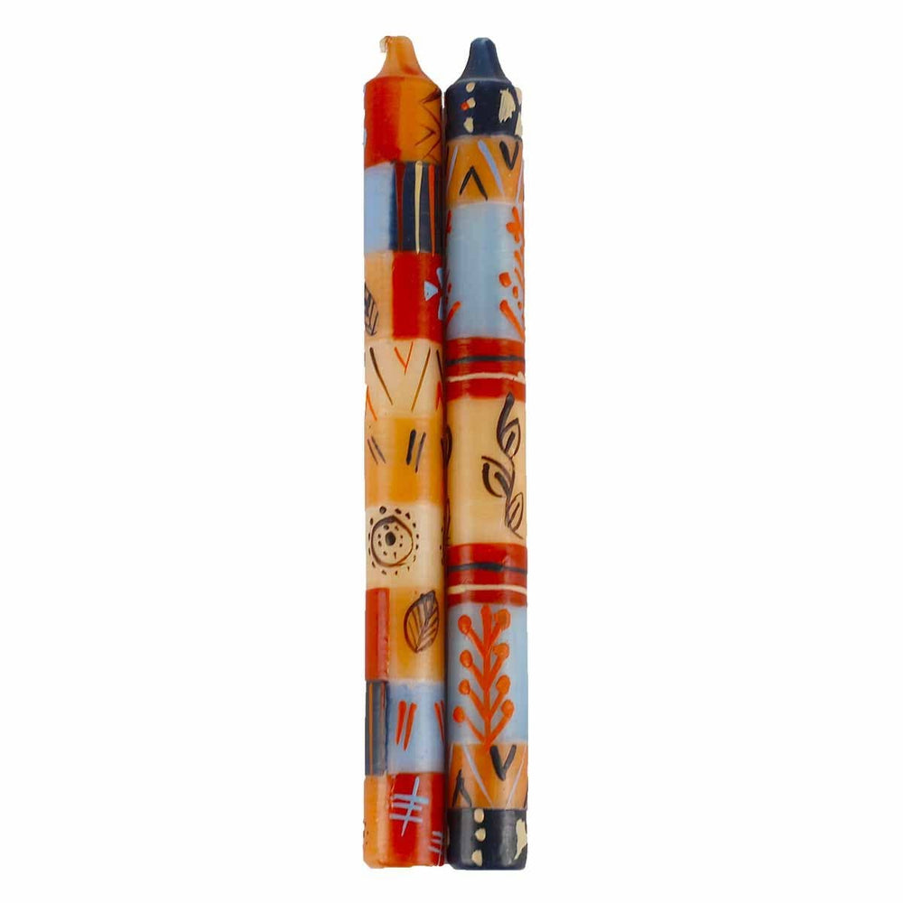 
                  
                    Two colorful candles with intricate patterns on a white background
                  
                