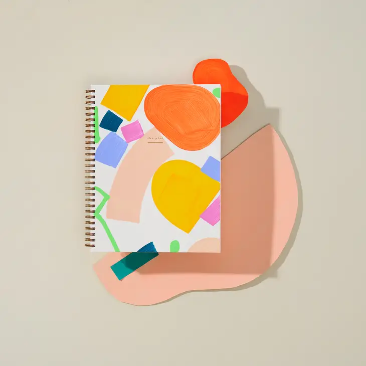 Hand painted notebooks in weekly undated planner style with color blocked bright warm colors