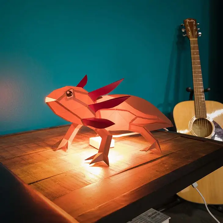 
                  
                    Paper axolotl lamp made from a template for kirigami art for beginners.
                  
                