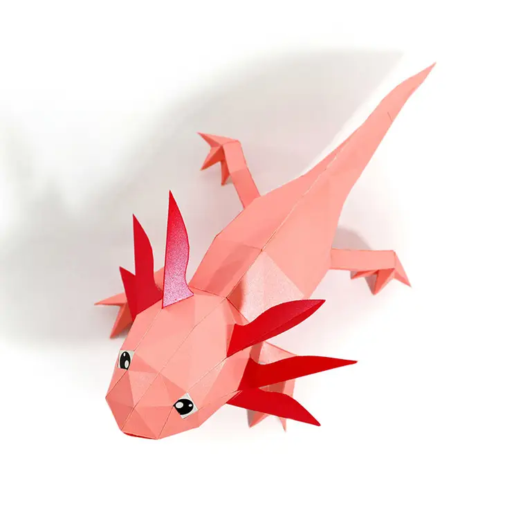 
                  
                    Top view of a kirigami paper axolotl, made from a template for kirigami art for beginners.
                  
                