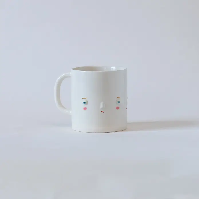 Mood changing mug with multiple emotion mugs faces, grumpy face