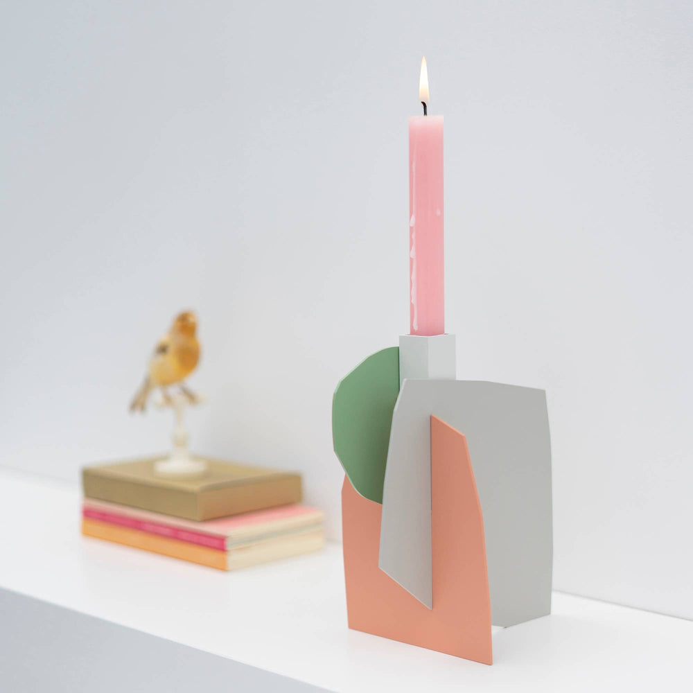 
                  
                    Matisse-inspired pastel metal candlestick holder
                  
                