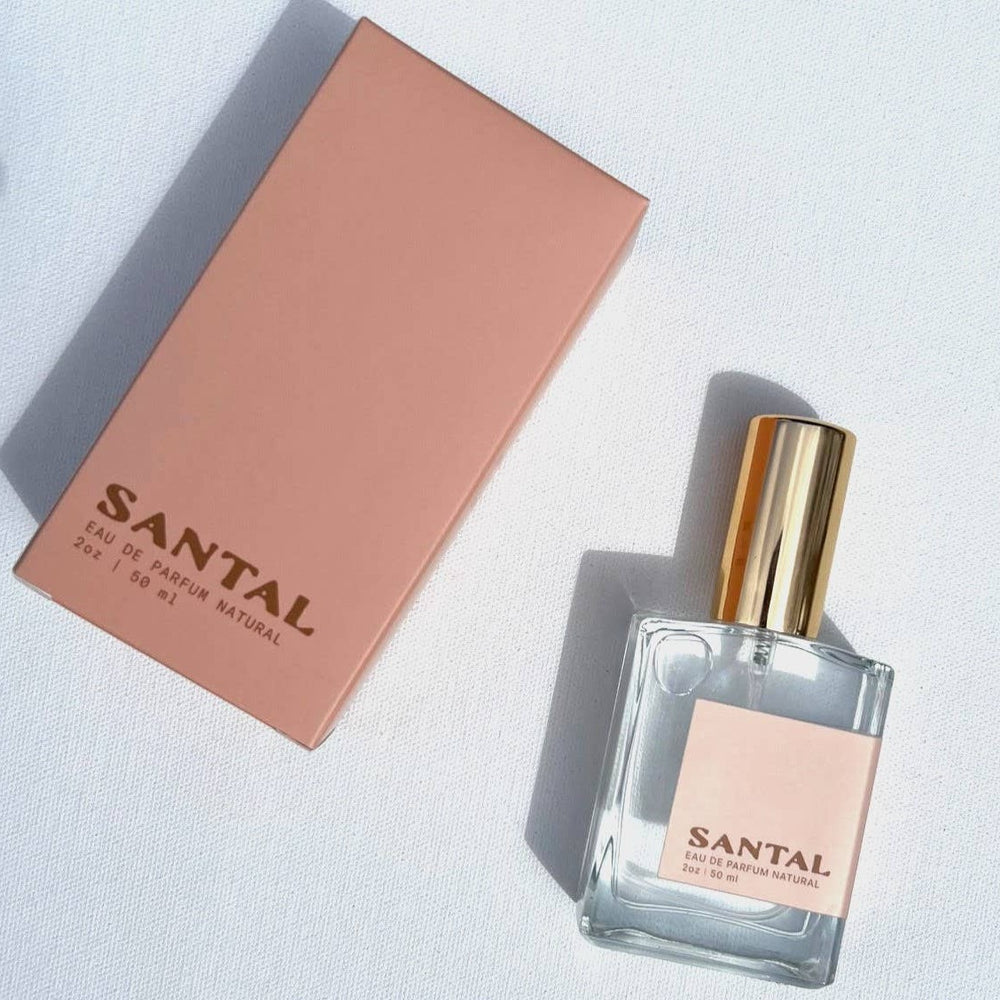 A bottle of Santal perfume with the box