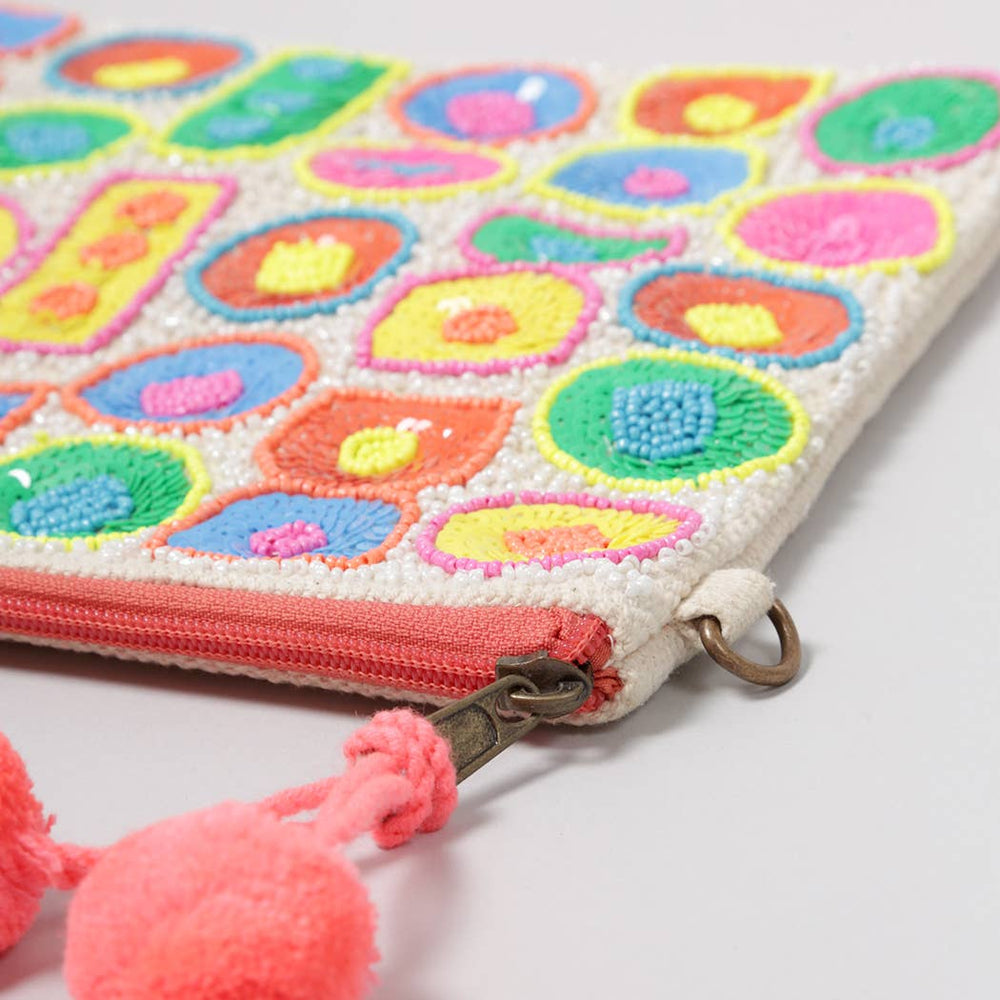 
                  
                    Pom pom and zipper detail on pom pom embroidered seed bead purse
                  
                