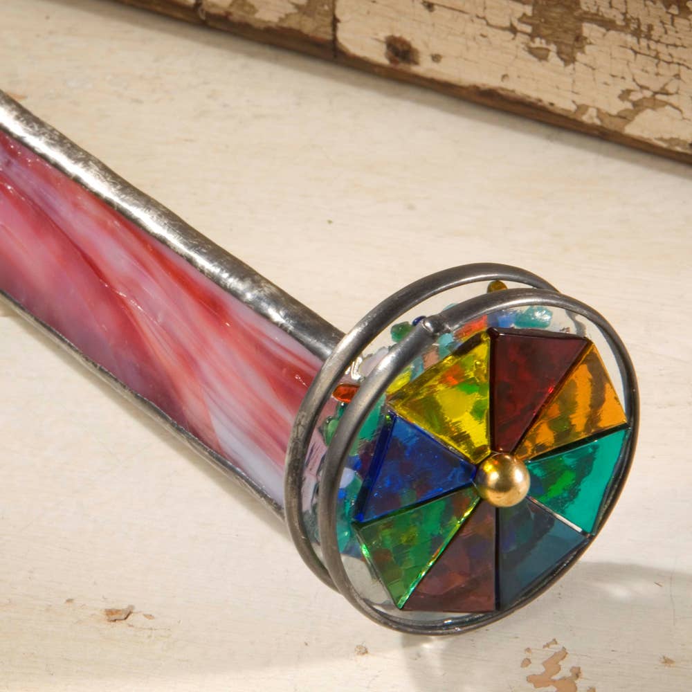 Red stained glass kaleidoscope with primary color stained glass spinning pinwheel