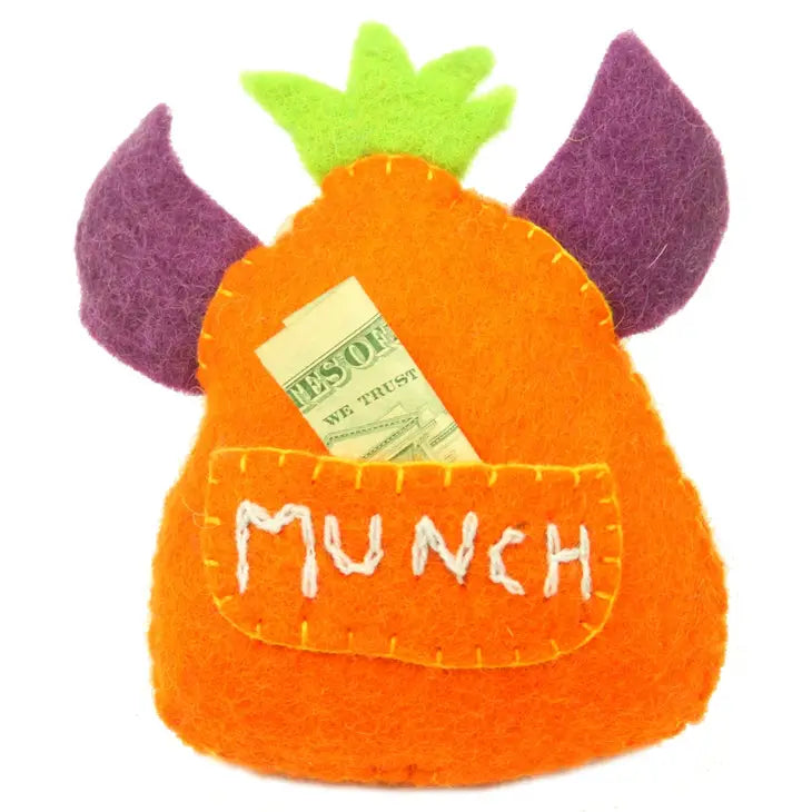 
                  
                    Tooth pocket on the back of orange monster tooth fairy pillow boy style with purple felt horns
                  
                