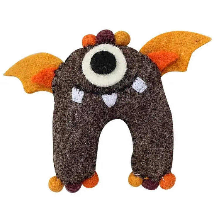 
                  
                    Brown monster tooth fairy pillow boy style made from felt with one eye, yellow felt wings and pompom toes
                  
                