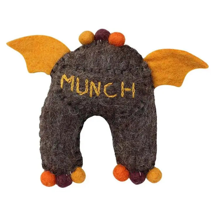 
                  
                    Tooth pocket on the back of brown monster tooth fairy pillow boy style with felt wings
                  
                