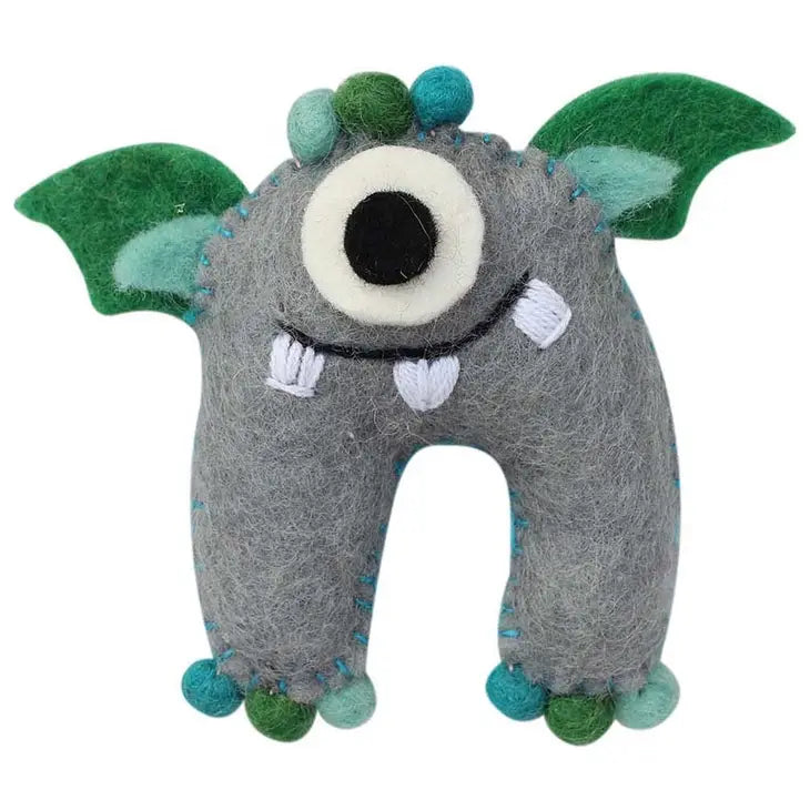 
                  
                    Gray monster tooth fairy pillow boy style made from felt with one eye and green wings
                  
                