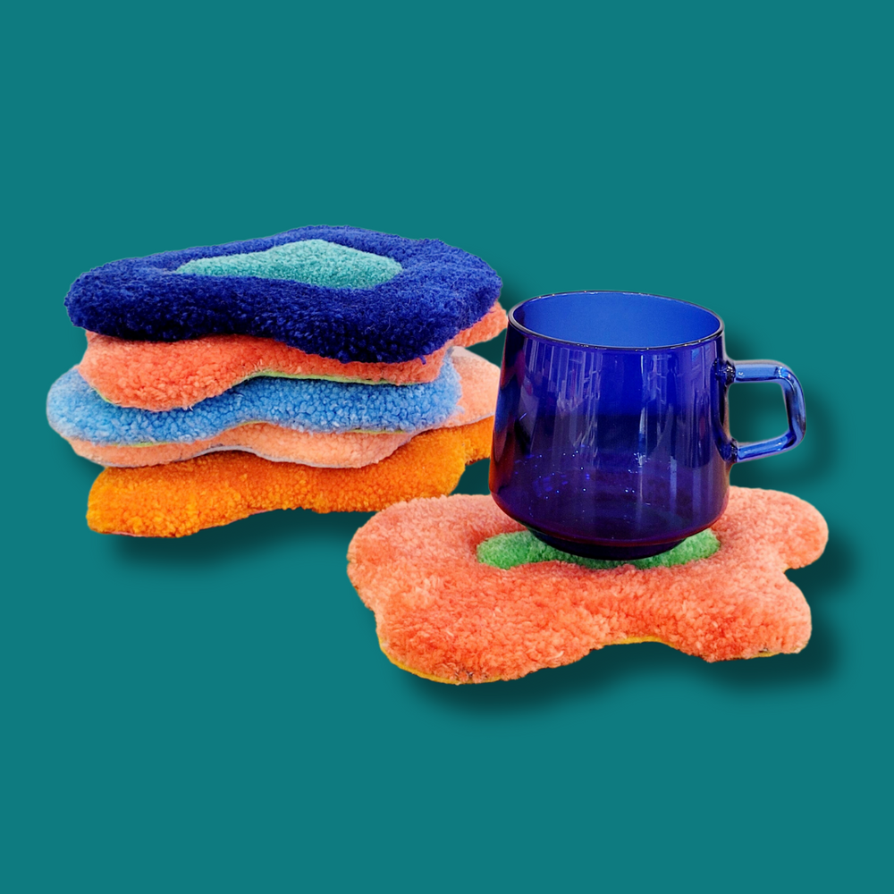 Shag tufted tapestry coasters with irregular blob shapes in two tone color blocking and assorted color combinations