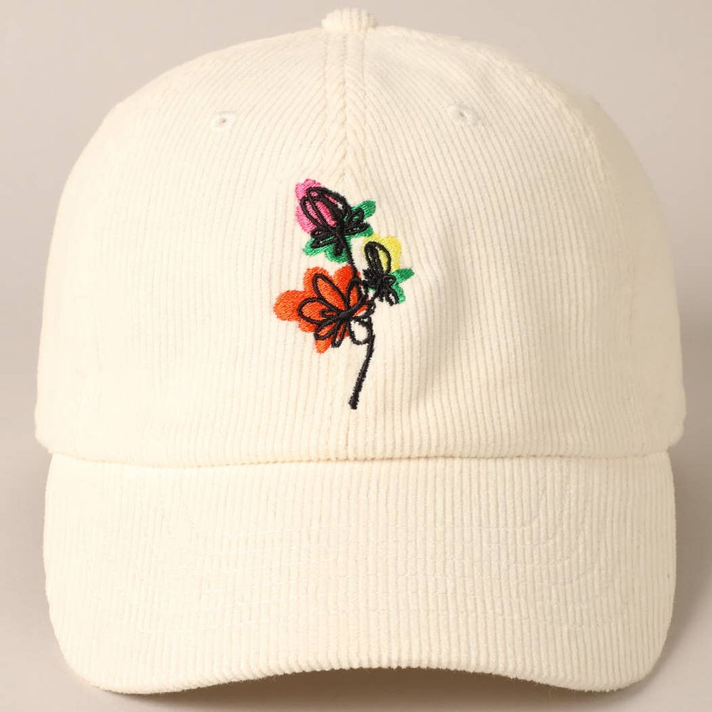 White corduroy baseball cap with small, modern art floral embroidery on the front